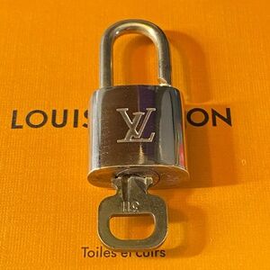 Louis Vuitton brass lock set with key #311 very good condition! Authentic